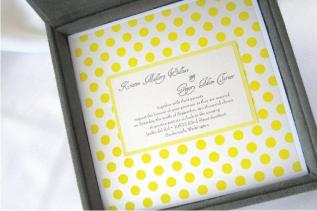Yellow and gray polka-dotted wedding invitation in invitation box