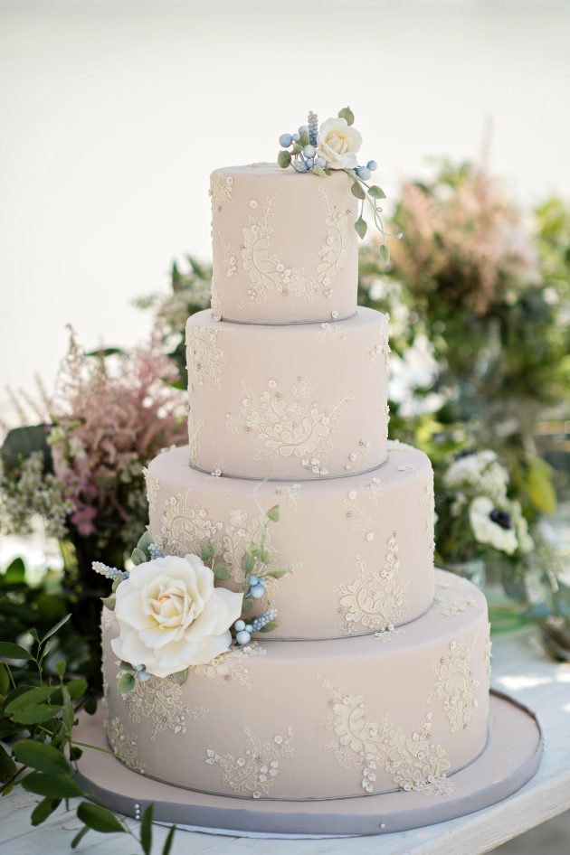 Cream wedding cake with appliques